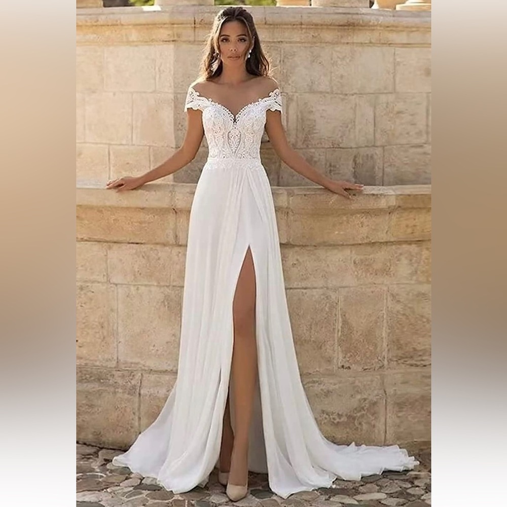 Wedding dress, never worn and not altered!